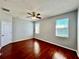 Bedroom featuring a view of the water, hardwood floors and a ceiling fan at 1945 Fruitridge St, Brandon, FL 33510