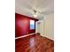 Bedroom features hard wood floors, a ceiling fan, a closet, and one window at 1945 Fruitridge St, Brandon, FL 33510