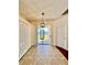 Dining area features access to backyard, neutral tile flooring, and coat closet at 1945 Fruitridge St, Brandon, FL 33510