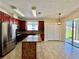 Modern kitchen featuring granite countertops, stainless steel appliances, and a center island at 1945 Fruitridge St, Brandon, FL 33510