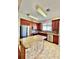 Bright kitchen features an island with granite countertops and stainless steel appliances at 1945 Fruitridge St, Brandon, FL 33510