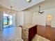 Kitchen island overlooks dining area and backyard with water view at 1945 Fruitridge St, Brandon, FL 33510