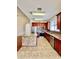 Spacious kitchen boasts stainless steel appliances, granite counters, an island and tile flooring at 1945 Fruitridge St, Brandon, FL 33510