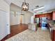 View of kitchen and living area featuring open floor plan and modern lighting fixtures at 1945 Fruitridge St, Brandon, FL 33510