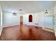 Expansive living room boasting gleaming wood floors and neutral color palette at 1945 Fruitridge St, Brandon, FL 33510