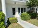 A cozy condo entrance shows the walkway, front door, and exterior of the unit at 2220 Swedish Dr # 8, Clearwater, FL 33763