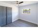 Neutral bedroom with light-colored, hard surface floors and closet with double doors at 2413 Wishing Well Way, Tampa, FL 33619