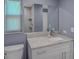 Bathroom features a granite vanity, framed mirror, and a large shower/tub combo, plus a toilet and window at 2988 Pinewood Run, Palm Harbor, FL 34684