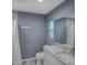 This bathroom features a granite countertop vanity with new faucet and framed mirror, plus a tub/shower combo at 2988 Pinewood Run, Palm Harbor, FL 34684