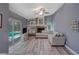 Cozy living room features a fireplace, sliding glass doors, and stylish furnishings at 2988 Pinewood Run, Palm Harbor, FL 34684