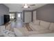 Spacious living room with a view of the dining area and front entrance at 2988 Pinewood Run, Palm Harbor, FL 34684