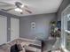 This office space features hardwood floors, a ceiling fan, and plenty of natural light from the nearby window at 2988 Pinewood Run, Palm Harbor, FL 34684