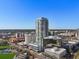 Stunning aerial view of the condo building with the bay and city skyline in the background at 301 1St S St # 1201, St Petersburg, FL 33701