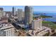 Scenic aerial view of downtown condos, hotel, a swimming pool, the water, and a baseball field in a vibrant city setting at 301 1St S St # 1201, St Petersburg, FL 33701