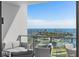 Relaxing balcony seating area with stunning views of the bay and baseball stadium at 301 1St S St # 1201, St Petersburg, FL 33701