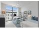 This bedroom features a ceiling fan and a large window to offer city views at 301 1St S St # 1201, St Petersburg, FL 33701