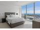 This bright bedroom features large windows with a stunning marina view and modern, neutral decor at 301 1St S St # 1201, St Petersburg, FL 33701