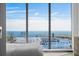 Bright bedroom showcases marina and ocean views through expansive windows at 301 1St S St # 1201, St Petersburg, FL 33701