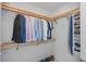 Walk in closet with multiple rows of shelves and ample space to hang clothing at 301 1St S St # 1201, St Petersburg, FL 33701