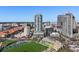 View of the high-rise condo in an urban area with cityscape, stadium and lush greenery at 301 1St S St # 1201, St Petersburg, FL 33701