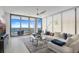 This living room boasts expansive windows with breathtaking marina views and comfortable contemporary furnishings at 301 1St S St # 1201, St Petersburg, FL 33701