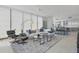 Open concept living space with modern furnishings, oversized windows and a view to the eat-in kitchen at 301 1St S St # 1201, St Petersburg, FL 33701