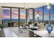 Bright living room with floor to ceiling windows offering stunning ocean views and a modern ceiling fan at 301 1St S St # 1201, St Petersburg, FL 33701