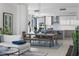 Open-concept living area with modern kitchen, comfortable seating, and stylish décor at 301 1St S St # 1201, St Petersburg, FL 33701