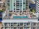 Rooftop pool with lounge chairs, umbrellas, and bay views at 301 1St S St # 1201, St Petersburg, FL 33701