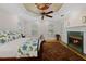 Bedroom featuring a decorative ceiling, fireplace, and custom built-in shelving at 3041 Dominion Ct, Safety Harbor, FL 34695