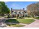 Beautiful two-story home with a manicured lawn, brick driveway, and inviting front porch at 3041 Dominion Ct, Safety Harbor, FL 34695