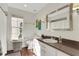 Bright bathroom featuring a granite countertop, modern fixtures, and abundant natural light from the window at 355 21St Ne Ave, St Petersburg, FL 33704