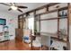 Bright bedroom with built-in shelving, a ceiling fan, hardwood floors, and an artist's easel at 355 21St Ne Ave, St Petersburg, FL 33704