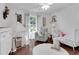 Well-lit bedroom featuring a play tent, rocking chair, crib and hardwood floors for relaxing moments at 355 21St Ne Ave, St Petersburg, FL 33704