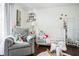 Bright bedroom with hardwood floors, rocking chair and crib with toys for a cozy, comforting space at 355 21St Ne Ave, St Petersburg, FL 33704
