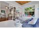 Well lit bedroom; features a comfortable daybed, large windows, and hardwood floors, with play furniture at 355 21St Ne Ave, St Petersburg, FL 33704