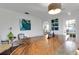 Bright dining room with a live-edge wood table, stylish seating, modern art, and ample natural light at 355 21St Ne Ave, St Petersburg, FL 33704