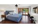Bright main bedroom with sliding doors to outside patio and dark wood flooring throughout at 355 21St Ne Ave, St Petersburg, FL 33704