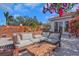 Inviting outdoor patio features a cozy seating area with plush cushions and lovely bougainvillea for relaxed lounging at 355 21St Ne Ave, St Petersburg, FL 33704