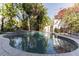 Inviting swimming pool and spa surrounded by lush tropical landscaping, perfect for relaxation and recreation at 355 21St Ne Ave, St Petersburg, FL 33704