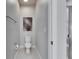 Modern half-bathroom featuring a sleek toilet, tiled floor and neutral walls at 3753 Maxwell Park Dr, Sun City Center, FL 33573