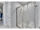 Bathroom featuring a glass shower with gray tile and updated fixtures at 3753 Maxwell Park Dr, Sun City Center, FL 33573