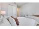 Comfortable bedroom with neutral tones, plush carpet, and a dresser offers lots of storage space at 3753 Maxwell Park Dr, Sun City Center, FL 33573