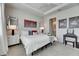 A well-lit bedroom with carpet flooring, tray ceilings and serene decor at 3753 Maxwell Park Dr, Sun City Center, FL 33573