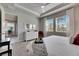 A spacious and sunlit bedroom featuring large windows and plush carpeting at 3753 Maxwell Park Dr, Sun City Center, FL 33573