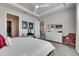 Bright bedroom with tray ceilings, soft carpet, ensuite access and modern furnishings at 3753 Maxwell Park Dr, Sun City Center, FL 33573