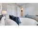 Inviting bedroom featuring a plush bed with decorative pillows and sliding closet doors at 3753 Maxwell Park Dr, Sun City Center, FL 33573