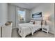 Cozy bedroom with a comfortable bed, soft textures, neutral color palette, and natural light at 3753 Maxwell Park Dr, Sun City Center, FL 33573