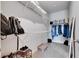 Spacious walk-in closet with wire shelving and carpet flooring at 3753 Maxwell Park Dr, Sun City Center, FL 33573