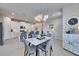 Open-concept layout featuring a dining area adjacent to a bright kitchen at 3753 Maxwell Park Dr, Sun City Center, FL 33573